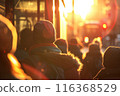 A crowd of people walking through the city on a sunny day at sunset. Hurry and lifestyle concept. blurred image 116368529