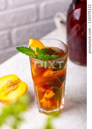 Cold ice tea with peach and mint 116370122