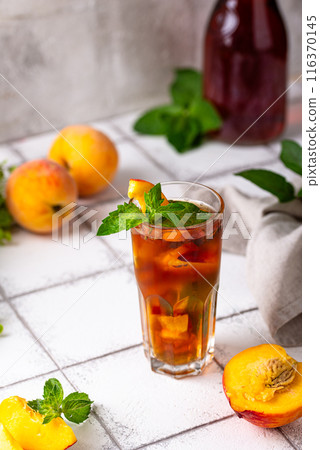 Cold ice tea with peach and mint Cold ice tea with peach and mint 116370145