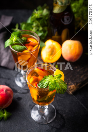Cold ice tea with peach and mint Cold ice tea with peach and mint 116370148
