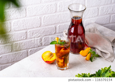 Cold ice tea with peach and mint Cold ice tea with peach and mint 116370154