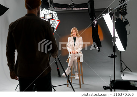 A woman at film studio set. Behind the scenes concept A woman at film studio set. Behind the scenes concept 116370166