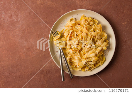 Fettuccine, tagliatelle, in creamy garlic sauce, Italian traditional cuisine, pasta carbonaro, Fettuccine, tagliatelle, in creamy garlic sauce, Italian traditional cuisine, pasta carbonaro, 116370171