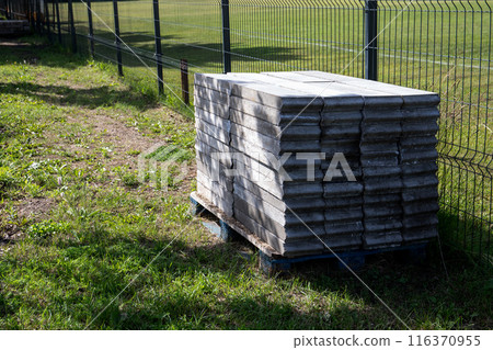 Paving stones in a pile, preparation for street construction 116370955