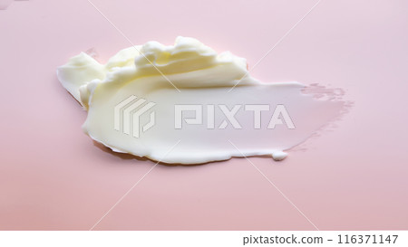 Texture of cosmetic butter on a pink background. Texture of cosmetic butter on a pink background. 116371147
