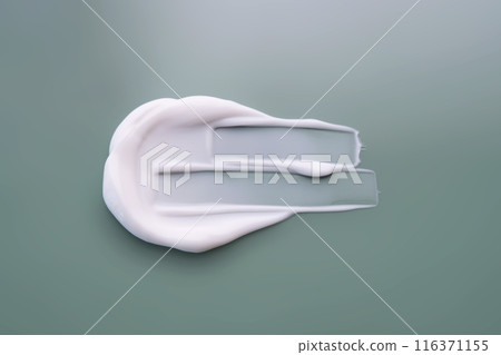 A smear of white cream on a green background. 116371155