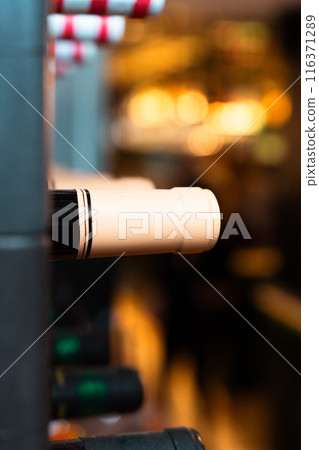 Bottles of wine stored in a restaurant cellar. Vertical Bottles of wine stored in a restaurant cellar. Vertical 116371289