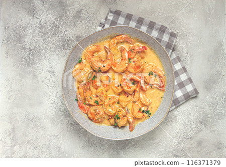 shrimp in creamy garlic sauce, with spices and herbs, 116371379