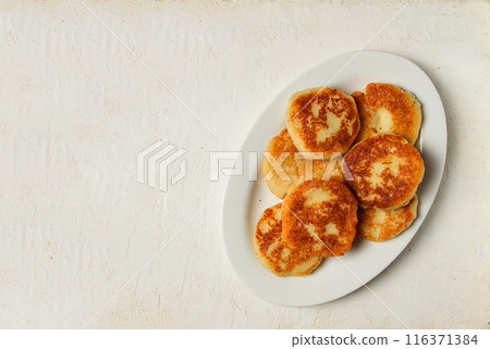 Chvishtari, corn flour tortillas with cheese, pastries, Georgian cuisine, Mchadi, homemade, top view, on a wooden table, no people, Chvishtari, corn flour tortillas with cheese, pastries, Georgian cuisine, Mchadi, homemade, top view, on a wooden table, no people, 116371384
