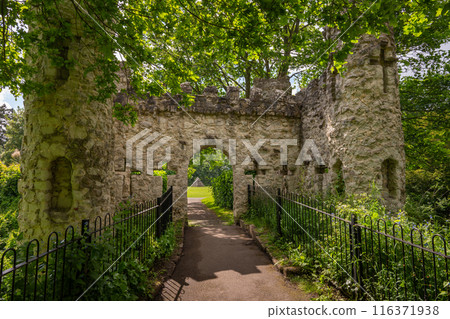 Castle Grounds, a public park in Reigate, Surrey, UK. While the castle no longer exists, a mock medieval gateway was built over the ruins in 1777. 116371938