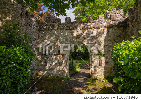 Castle Grounds, a public park in Reigate, Surrey, UK. While the castle no longer exists, a mock medieval gateway was built over the ruins in 1777. 116371940