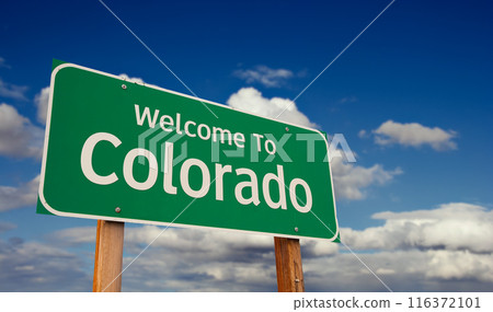 Welcome To Colorado Green Road Sign Over Blue Sky with Some Clouds. 116372101
