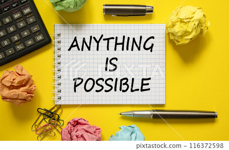 Anything is possible symbol. Concept words Anything is possible on beautiful white note. Beautiful yellow background. Black pen. Calculator. Business anything possible concept. Copy space. 116372598