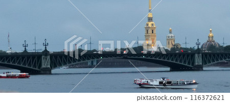 Beautiful view of the river, floating boats, a bridge. 116372621