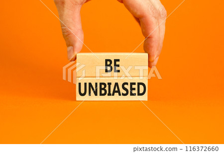 Be unbiased symbol. Concept words Be unbiased on wooden block. Beautiful orange table orange background. Businessman hand. Business psychology be unbiased concept. Copy space. 116372660