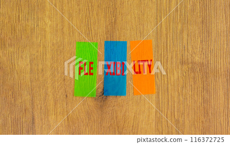 Flexibility symbol. Concept word Flexibility on beautiful colored paper. Beautiful wooden background. Business flexibility concept. Copy space. Flexibility symbol. Concept word Flexibility on beautiful colored paper. Beautiful wooden background. Business flexibility concept. Copy space. 116372725