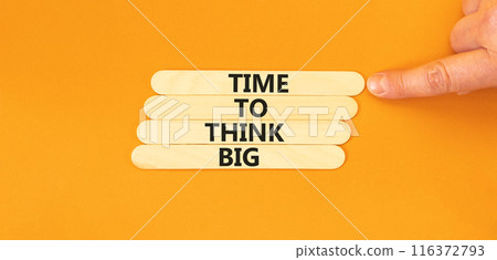 Time to think big symbol. Concept words Time to think big on wooden stick. Beautiful orange table orange background. Businessman hand. Business and time to think big concept. Copy space. 116372793