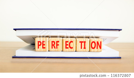 Perfection symbol. Concept word Perfection on beautiful wooden cubes in book. Beautiful wooden table white background. Business perfection concept. Copy space. Perfection symbol. Concept word Perfection on beautiful wooden cubes in book. Beautiful wooden table white background. Business perfection concept. Copy space. 116372807