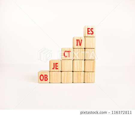 Objectives symbol. Concept word Objectives on beautiful wooden cubes. Beautiful white background. Business objectives concept. Copy space. 116372811