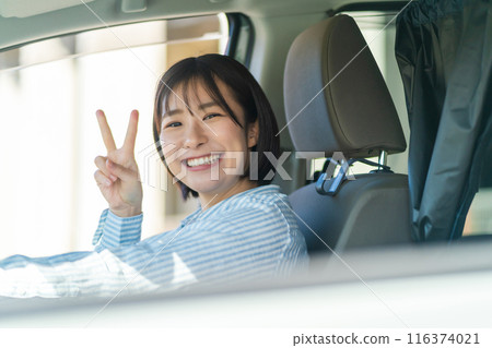 A woman driving a car A woman driving a car A woman driving a car A woman driving a car 116374021