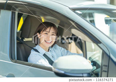 A woman driving a car A woman driving a car A woman driving a car A woman driving a car 116374271