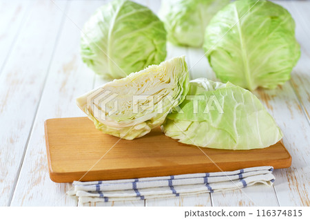 Whole and quarter green cabbage on a wooden table, Whole and quarter green cabbage on a wooden table, 116374815