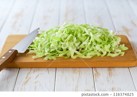 fresh green cabbage on a cutting board, selective focus. fresh green cabbage on a cutting board, selective focus. 116374825