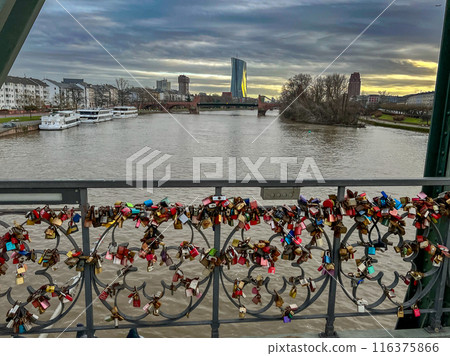 The bridge called Eiserner Steg in Frankfurt with the romantic act of locks of love, padlocks with the names of the loved ones on it. 116375866