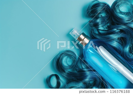 Bottle of shampoo and hair curlers on blue background, top view Bottle of shampoo and hair curlers on blue background, top view 116376188