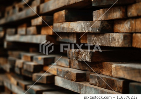 Pile of old wooden planks in a warehouse. Wood wall background and texture 116376212