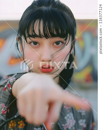 Asian woman pointing 116377124