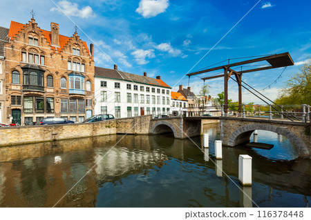 View of Bruges canal and old historic houses of medieval architecture. Brugge, Belgium 116378448