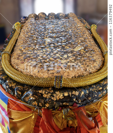 The footprint of the Buddha is sacred to Buddhists. 116379492