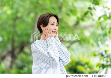 Fresh greenery Middle-aged woman Beauty 116380838