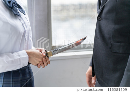 A high school girl points a knife at a man (assault, self-defense, crime, intimidation) 116381509