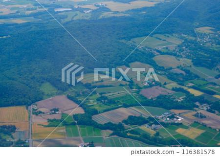 Patchwork pattern of fields above Chitose in July 116381578