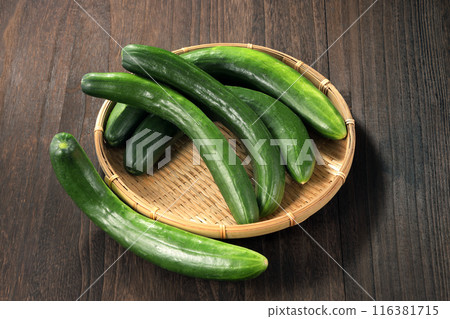 Fresh cucumbers in a colander Fresh cucumbers in a colander 116381715