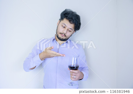A man introducing wine A man introducing wine 116381946