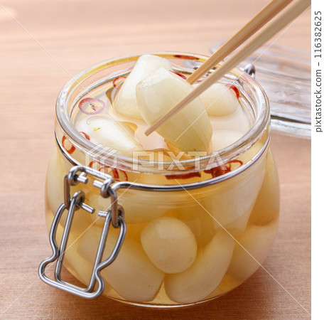 Pickled scallions in sweet vinegar made by my grandmother 116382625