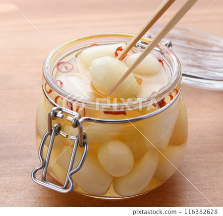 Pickled scallions in sweet vinegar made by my grandmother 116382628