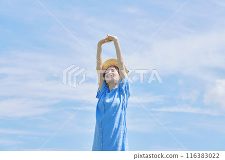 A woman stretching outdoors 116383022