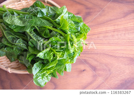 Purple cucumber in a colander 116383267