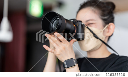 Photographer woman camera 116383318