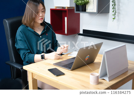 asian woman use laptop for working her business from home asian woman use laptop for working her business from home 116384275