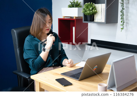 asian woman use laptop for working her business from home asian woman use laptop for working her business from home 116384276