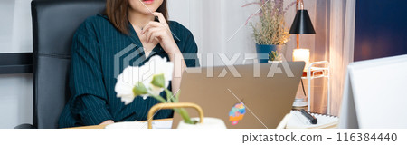 asian woman use laptop for working her business from home 116384440