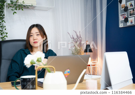 asian woman use laptop for working her business from home 116384466