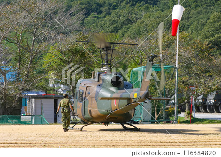 Ground Self-Defense Force helicopter UH-1J preparing for takeoff 116384820