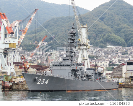 A Japanese Maritime Self-Defense Force destroyer undergoing repairs at a shipyard A Japanese Maritime Self-Defense Force destroyer undergoing repairs at a shipyard 116384853