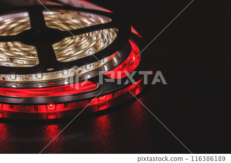 LED strip with red and warm white SMD LEDs, with a black background 116386189